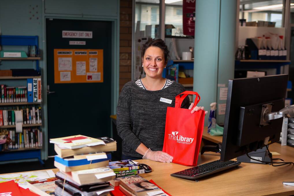 Home delivery: Cassie Carroll is working to deliver reserved books to Warrnambool residents to give them something to read during isolation. Picture: Morgan Hancock