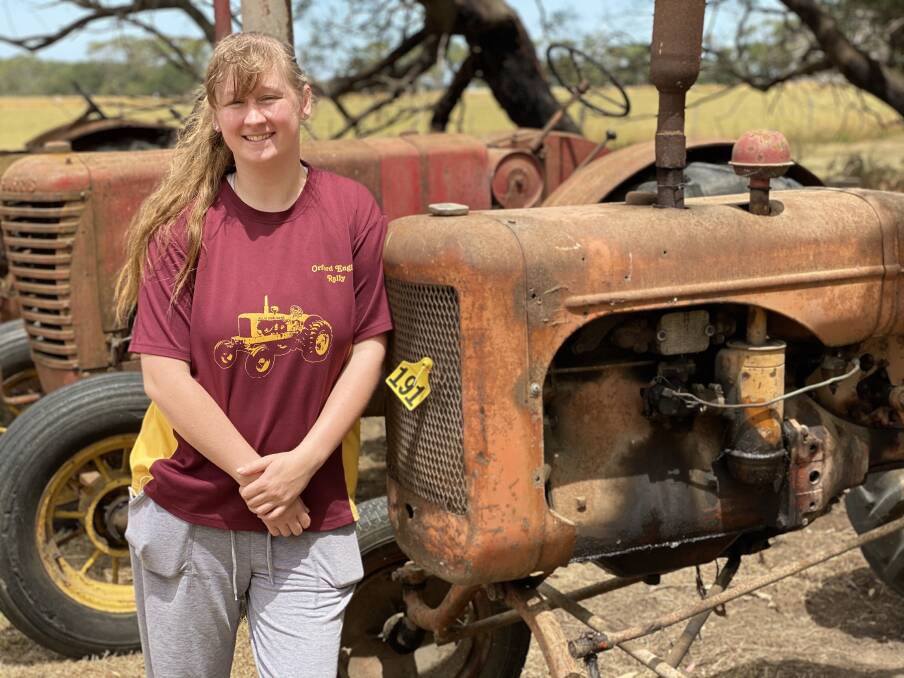 Vintage: Chloe Bartlett with one of the tractors that will be on display at the weekend.