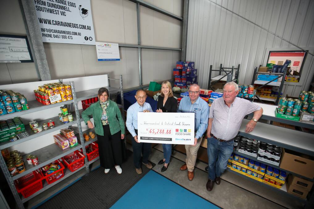 Generous: Jo McBain, Perry Cho, Amanda Hennessy, Jeff Dennis and Mick White with the cheque for more than $65,000 donated to Food Share. Picture: Morgan Hancock