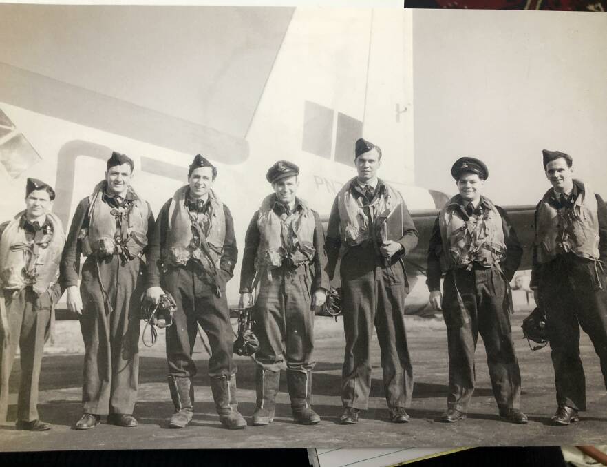 IN IT TOGETHER: Bill Sinclair (centre) after returning from flying a mission during WWII. 