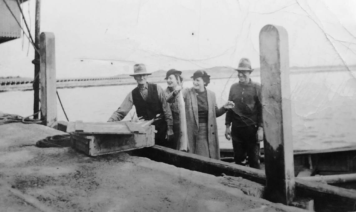 Fishing family: The only known photo of Roger Edwards, pictured with his son George and some other well-known Warrnambool women.