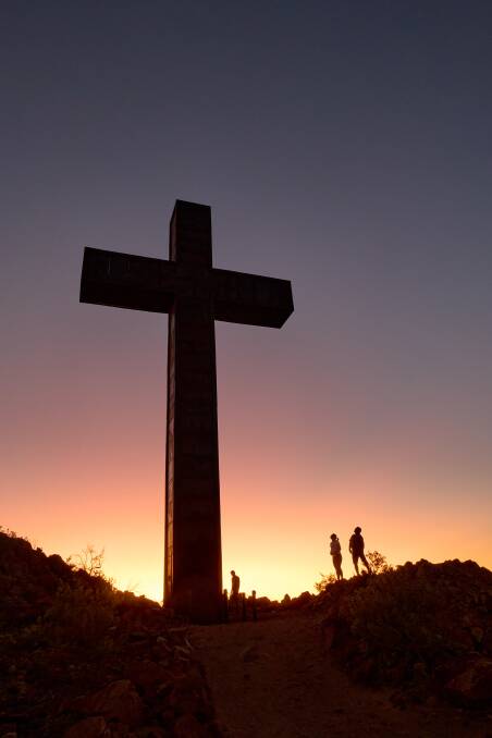 The giant cross atop Memory Mountain in outback Australia that has been erected by the residents.