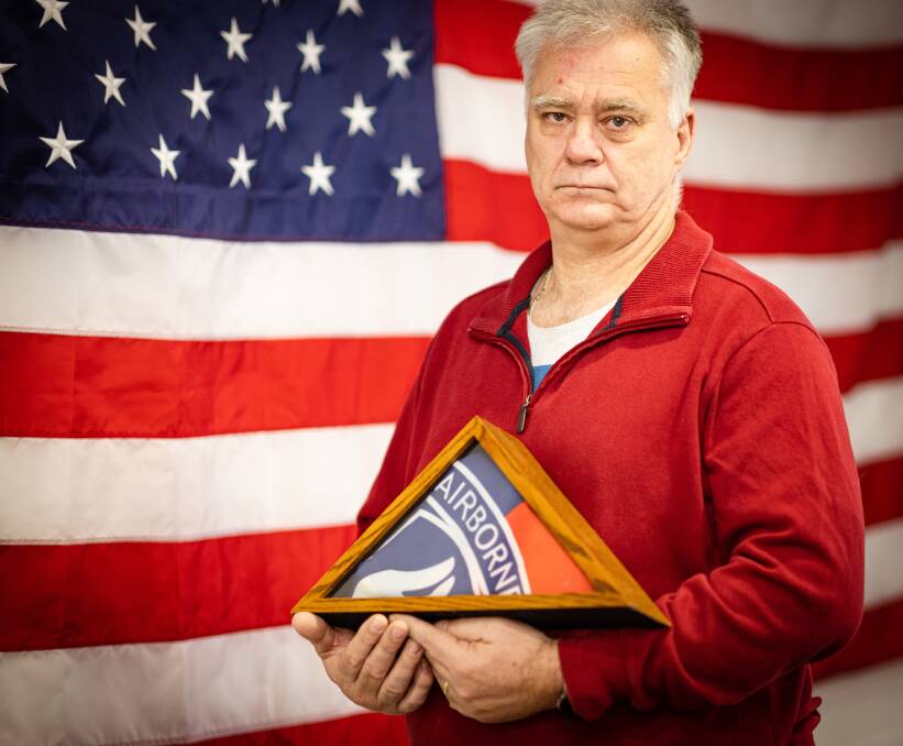 David Carroll with the 173rd Airborne flag and the US flag that he was given in honour of his father who died in Vietnam. Picture by Sean McKenna