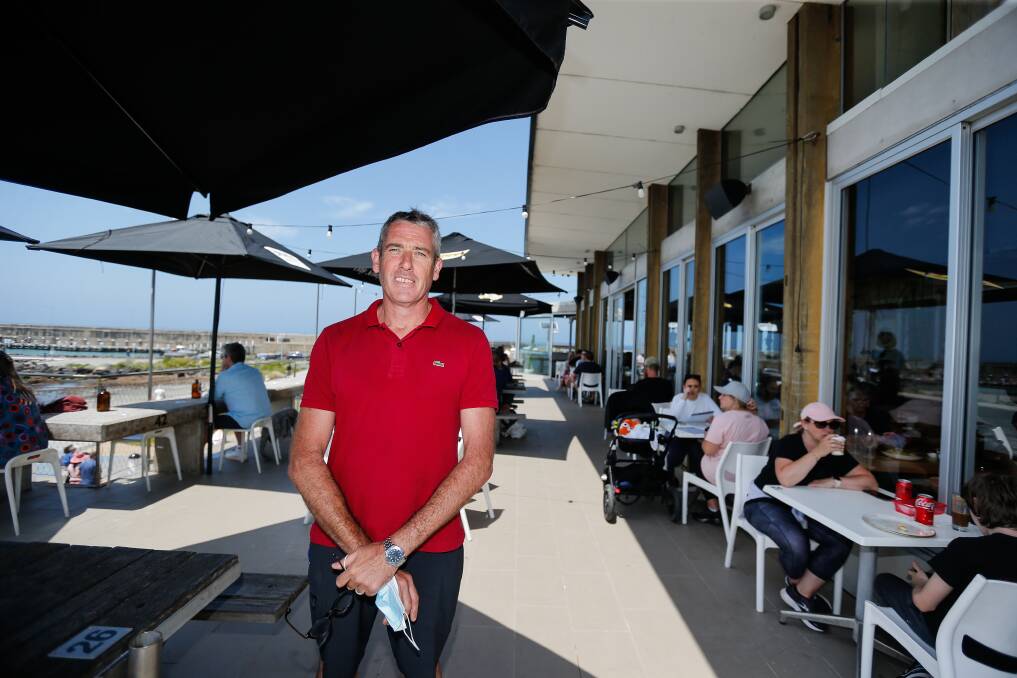 Jon Watson said the number of patrons through his foreshore cafe was good, but they weren't spending like they used to. Picture file