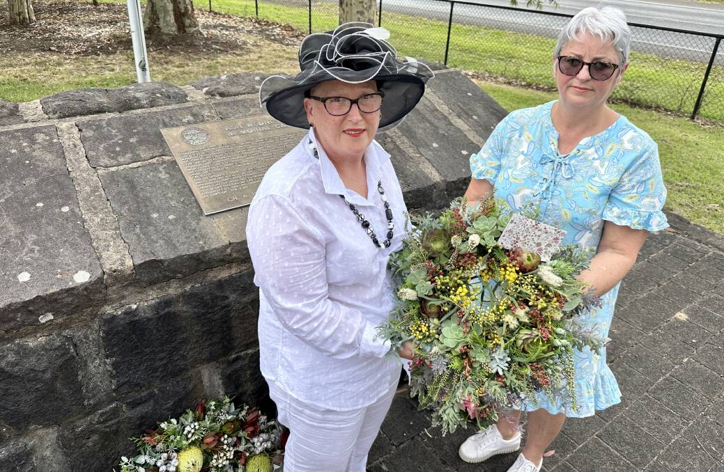 Camperdown's Debbie Dolan and Warrnambool Shiree Wright lay a wreath for the father and brother they lost in the Ash Wednesday fires in 1983. Picture by Katrina Lovell