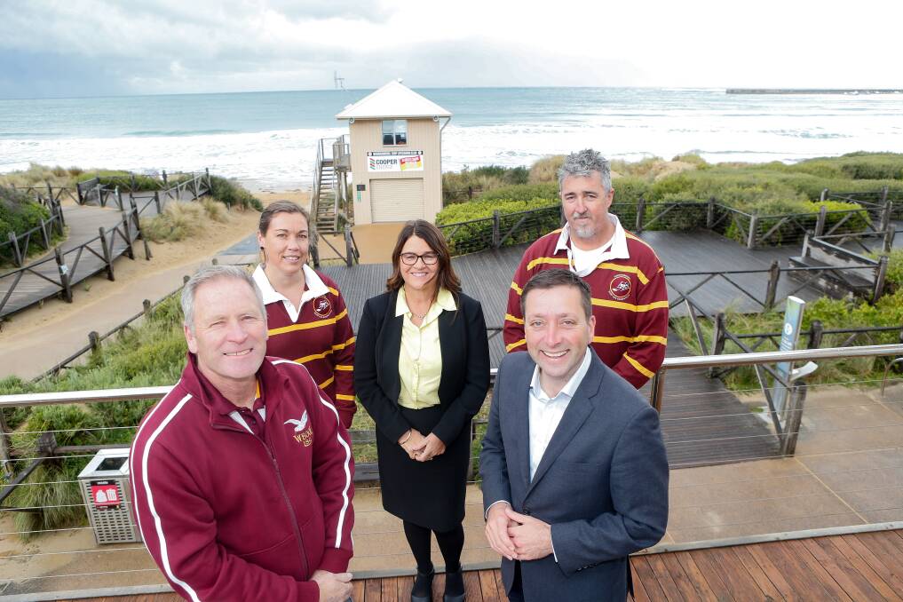 Overdue: Liberal leader Matthew Guy and South West Coast MP Roma Britnell announces $12 million to fund a new surf club, news that was welcomed by members John McNeil, Josephine McDowell and Travis Madigan. Picture: Anthony Brady