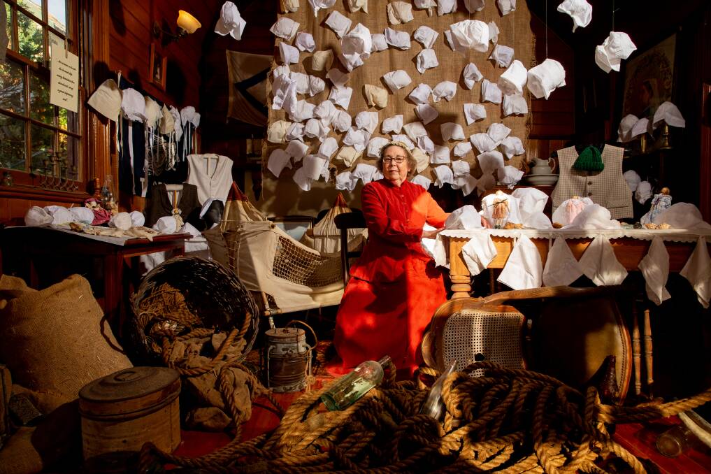 Tribute: Village volunteer Jenny Climas at the new Flagstaff Hill exhibition which showcases handmade bonnets which tell the story of one of Australia's worst shipwreck disasters in 1835. Picture: Chris Doheny