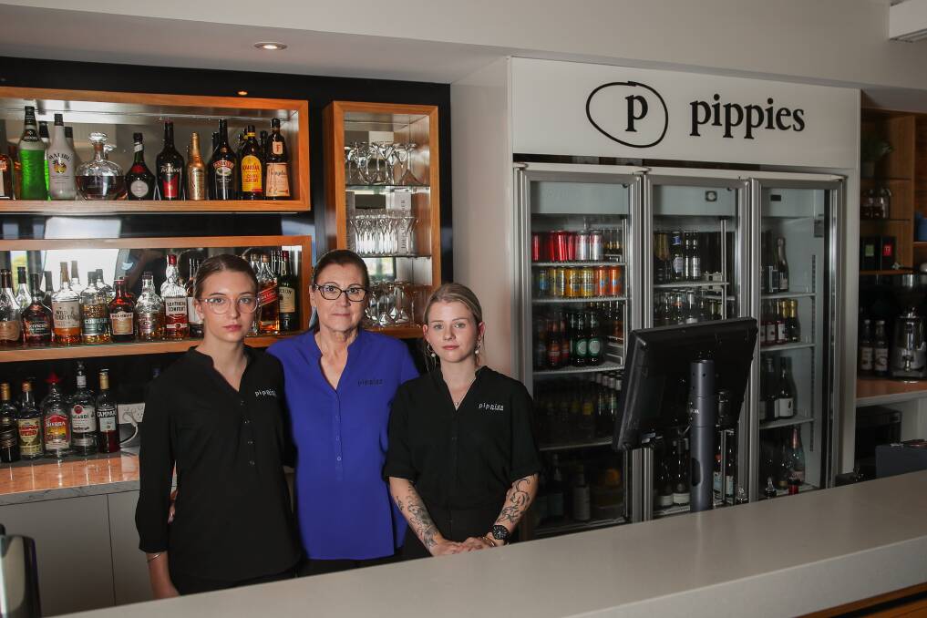 Short-staffed: Chloe Gale, Mandy Stoddart and Millie Quarrell at Pippies by the Bay which has had to close two days a week due to lack of staff. Picture: Morgan Hancock 