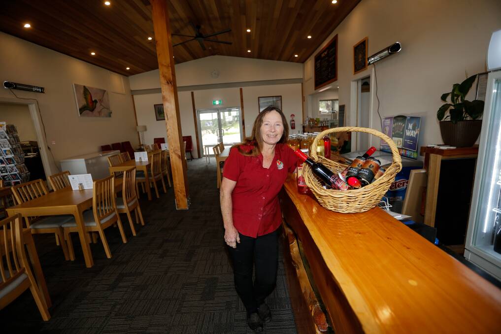 Back in business: Heather Nicholls has a new range of strawberry wine, liquor and cider after rebuilding the cafe that burnt down in 2020. Picture: Anthony Brady