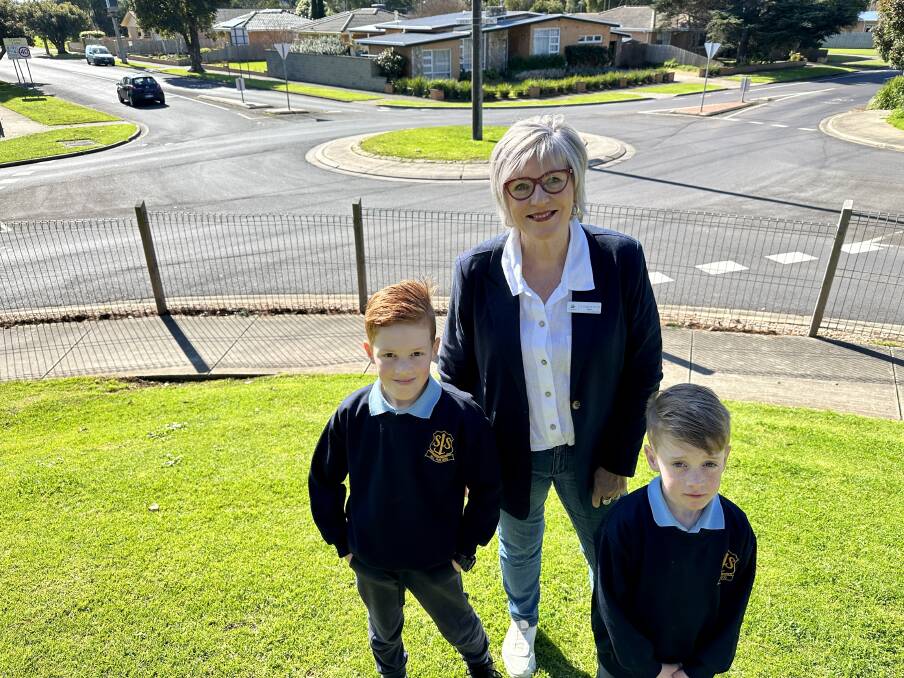 Warrnambool mayor Debbie Arnott with St Josephs Primary School pupils Elliot and Austin Smock at the roundabout that will undergo a major upgrade. 