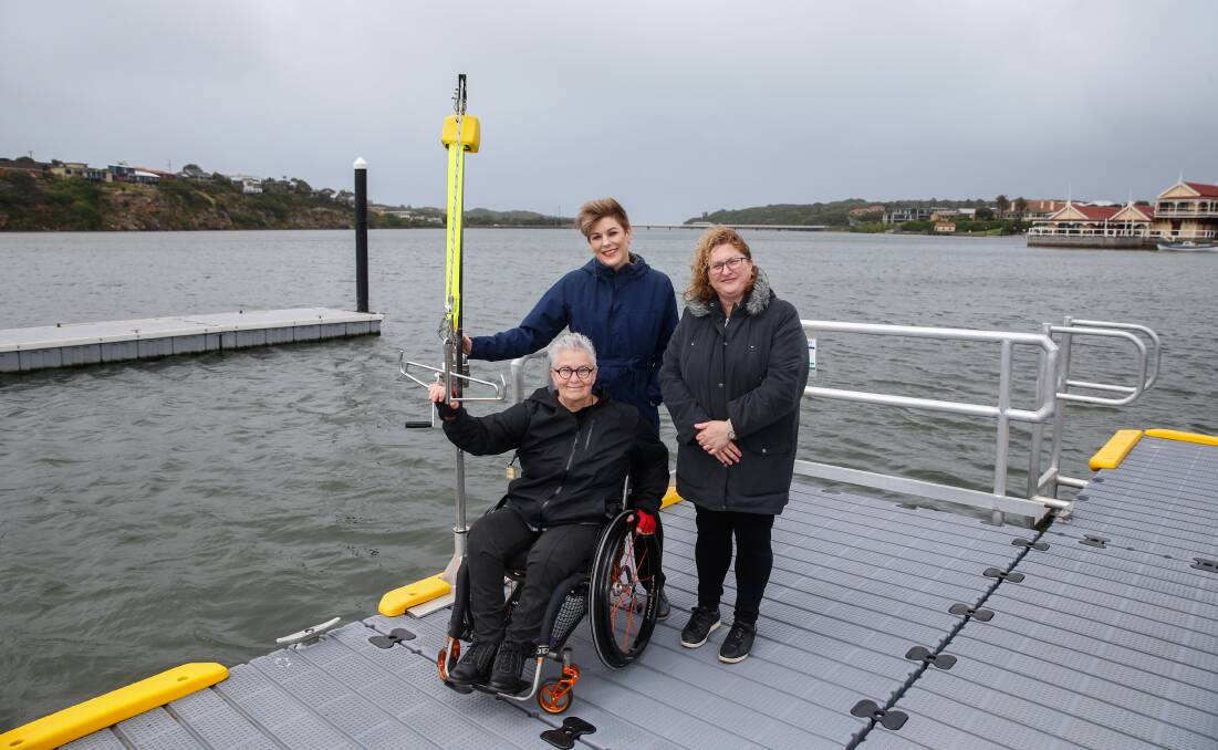 Making a splash: Georgia Richmond started lobbying two years ago for a hoist to get people of all abilities back onto the water. Councillor Sue Cassidy and Maree Wyse were there on Thursday to check out the newly completed facilities. Picture: Mark Witte