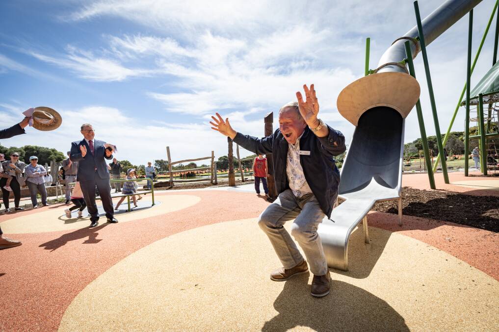 Deputy mayor Max Taylor makes the perfect landing after taking the new nine-metre slide at Lake Pertobe for a test run. Picture by Sean McKenna