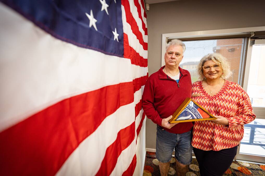 Lani and David Carroll with the American flag that has been sent to Warrnambool in honour of his dad Bill who was killed in the Vietnam War. They also have a flag from the 173rd Airborne that was also given to the family. Picture by Sean McKenna 