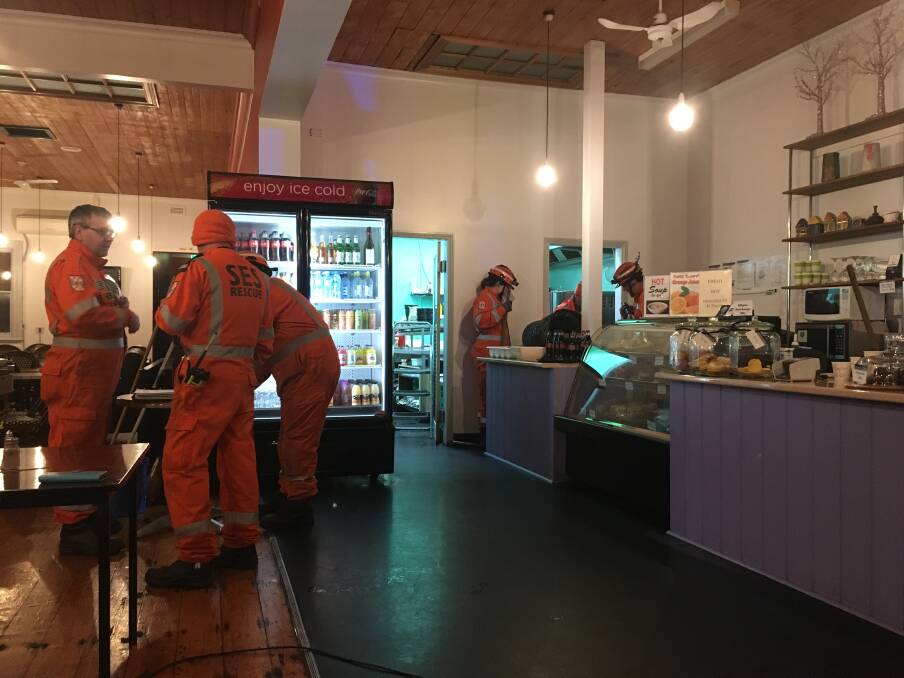 Clean-up: SES crews helped mop up at Hoppy's Cafe after it flooded.