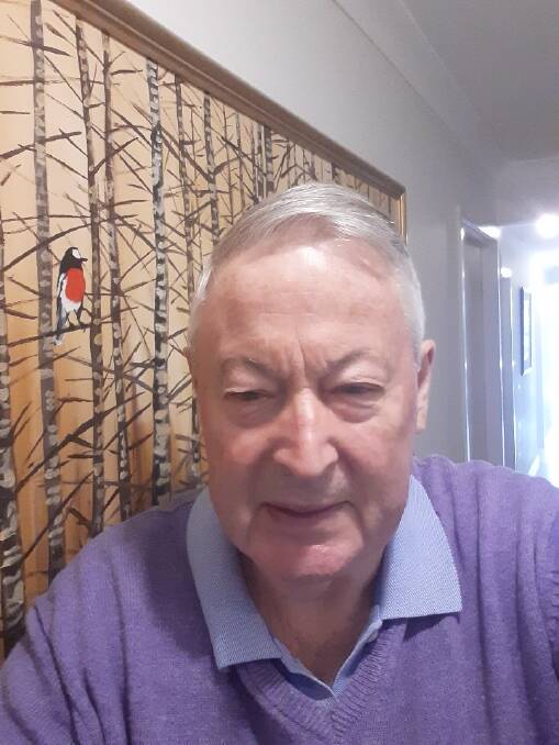 Ian Smith in front of the Robert Ulmann painting which reminds him of the Ash Wednesday bushfires and the 'hope' that came in the aftermath. Picture supplied