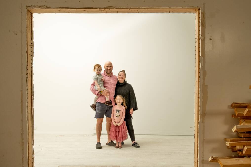 Nicole and Hugh Goldson with their children Matilda, 4, and Edie, 2, at the Timor Street property that is being renovated for their new restaurant. Picture: Chris Doheny 
