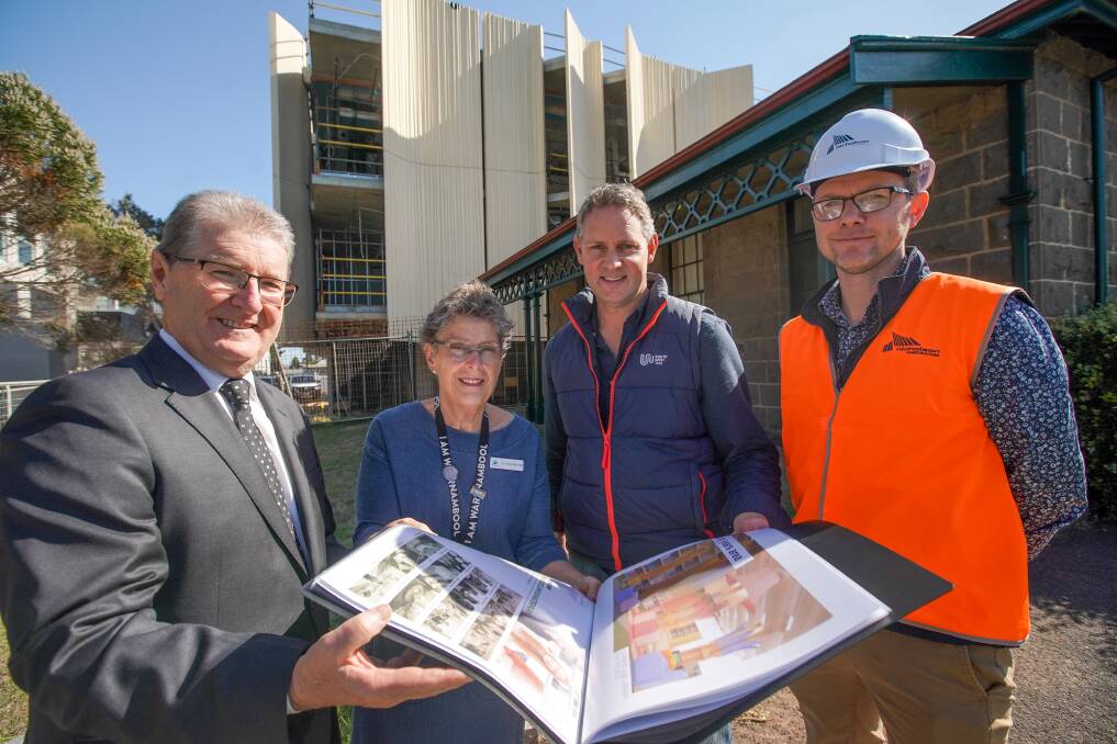 Grand: Council CEO Peter Schneider, mayor Vicki Jellie, Tafe's Mark Fidge and project manager Cathal Finnegan at the new library building which is nearing completion.