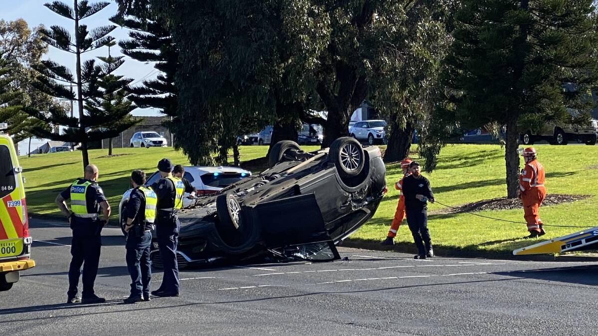 Lucky escape: The occupants of a car that flipped on Raglan Parade have been taken to hospital.