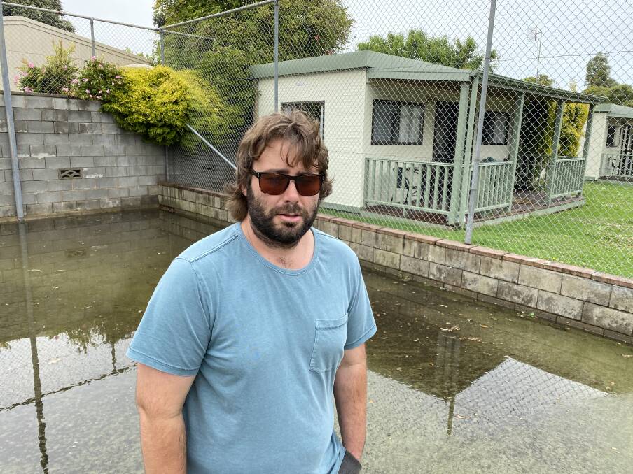 Inundated again: Jeremy Woolman says something needs to be done after his caravan park was inundated with floodwaters again.
