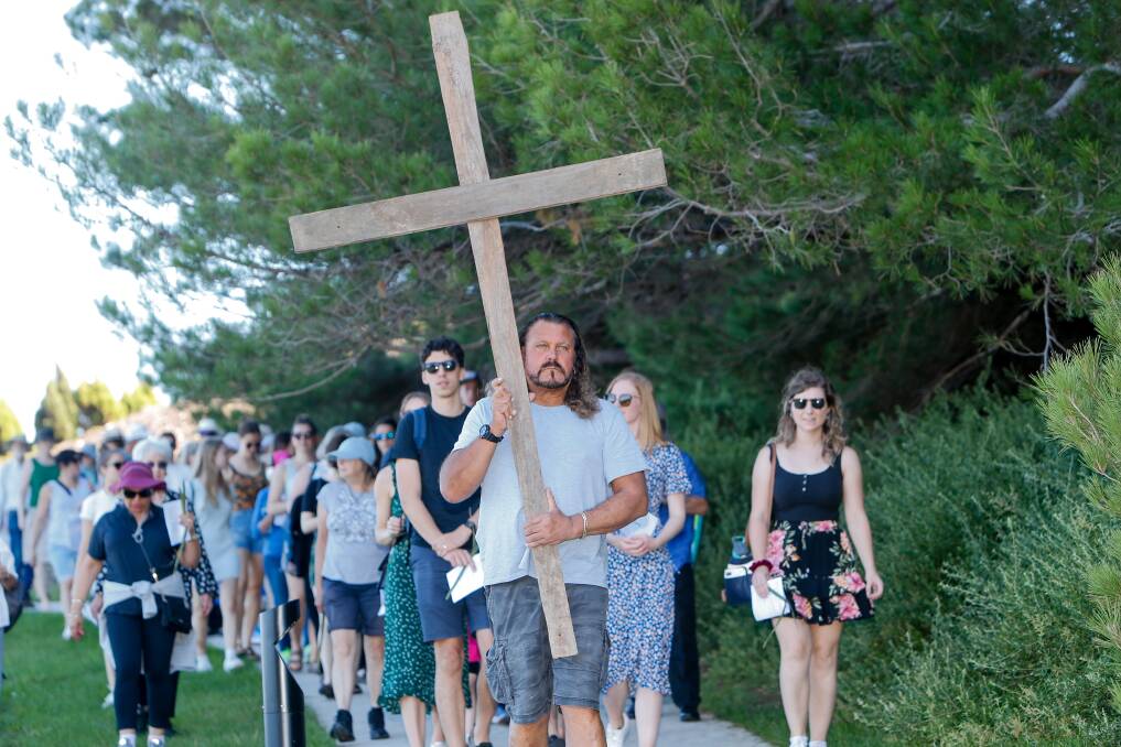Leading the way: Dozens took part in the Way of the Cross walk in Warrnambool on Friday. Picture: Anthony Brady