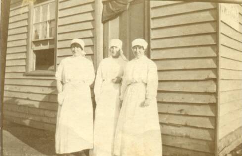 Primitive conditions: Nurses stand in front of the sleeping quarters in Warrnambool in 1919.