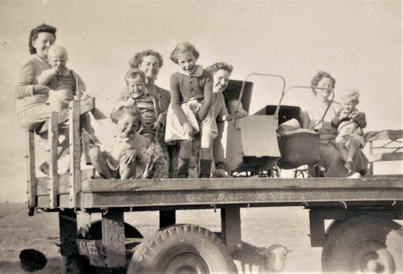 Soldier settlement families returning home after a birthday party on the back of truck. Photo: Marie Bonne