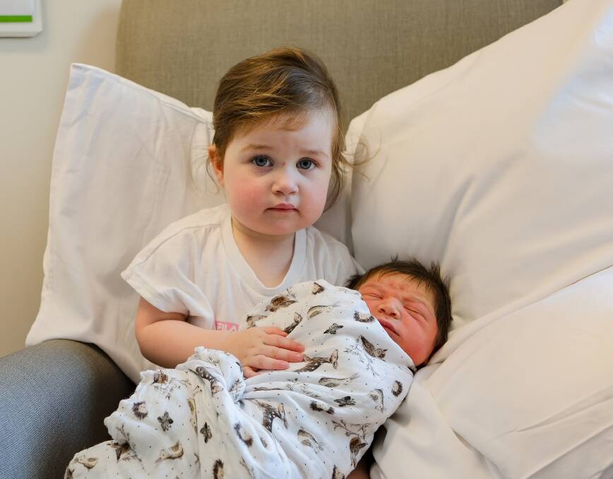 Birthday bond: Siblings Isla, 2, and newborn Ted Atwell were both born on Christmas Day. Picture by Anthony Brady