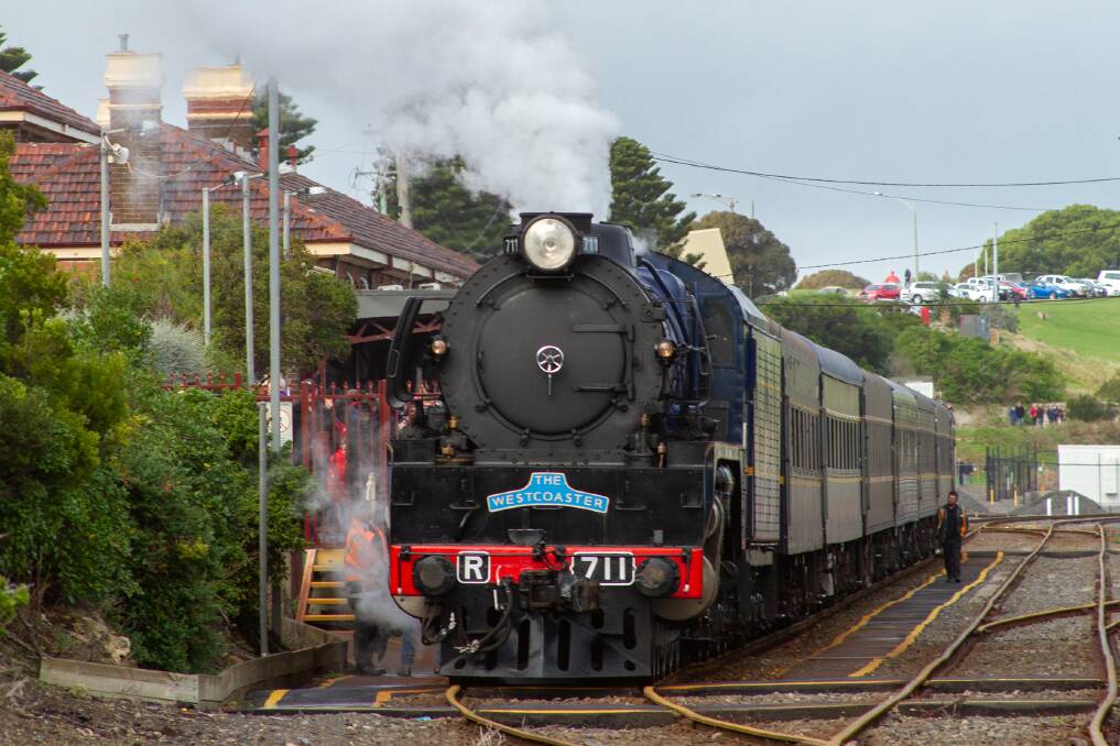 Popular: Crowds line the platform to greet the R711 as it arrives at the Warrnambool station on Saturday after an absence of more than a decade. Picture: Sophie Gibson.