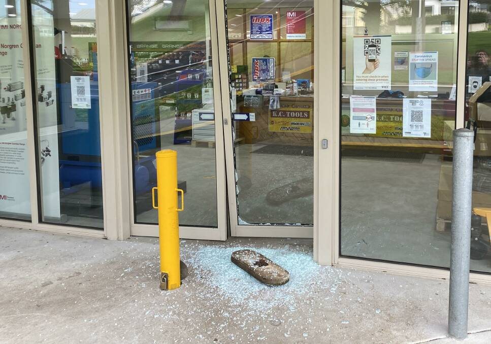 A concrete lid was used to smash in the front door of a Warrnambool business.