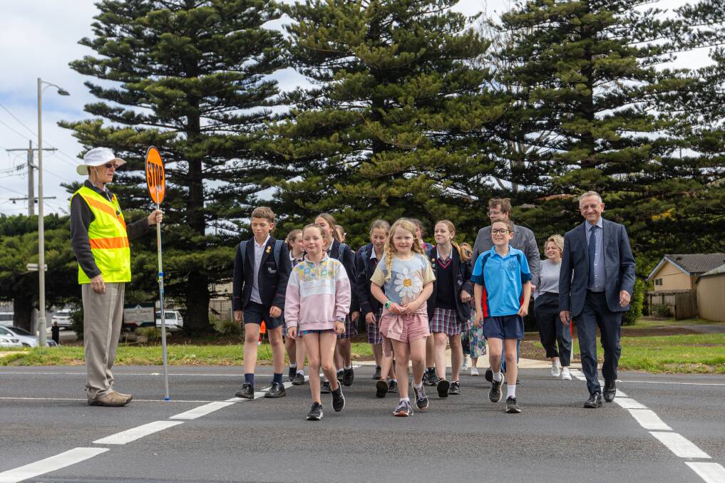 The community gives the new supervised school crossing on Raglan Parade a test run. Picture by Eddie Guerrero