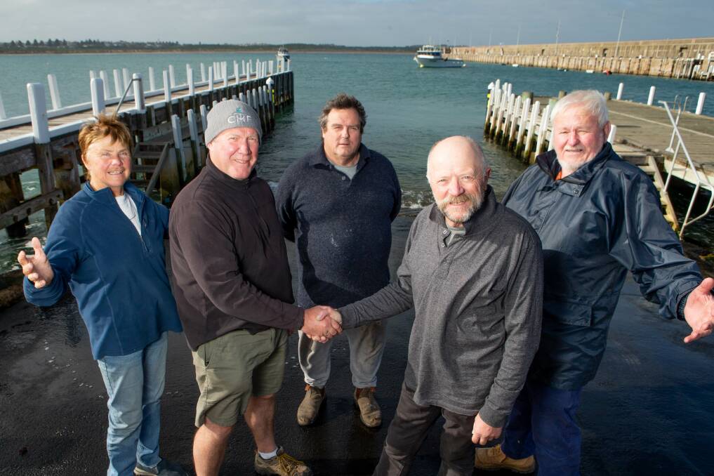 Time's up: Harbour reference group members in happier times celebrating the boat ramp funding with now mayor Richard Ziegler.