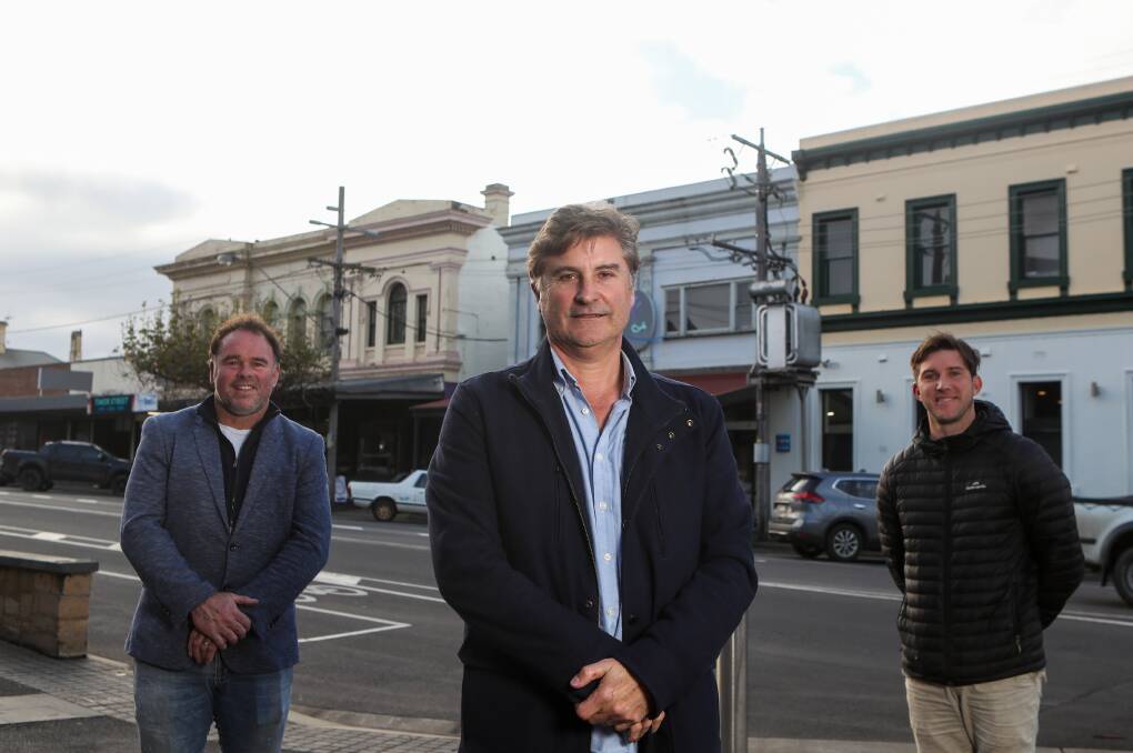 It's time: Clayton Harrington, Tony Herbert and Alister Porter celebrate a deal which will see buildings on Timor Street finally allowed to be painted. Picture: Morgan Hancock 