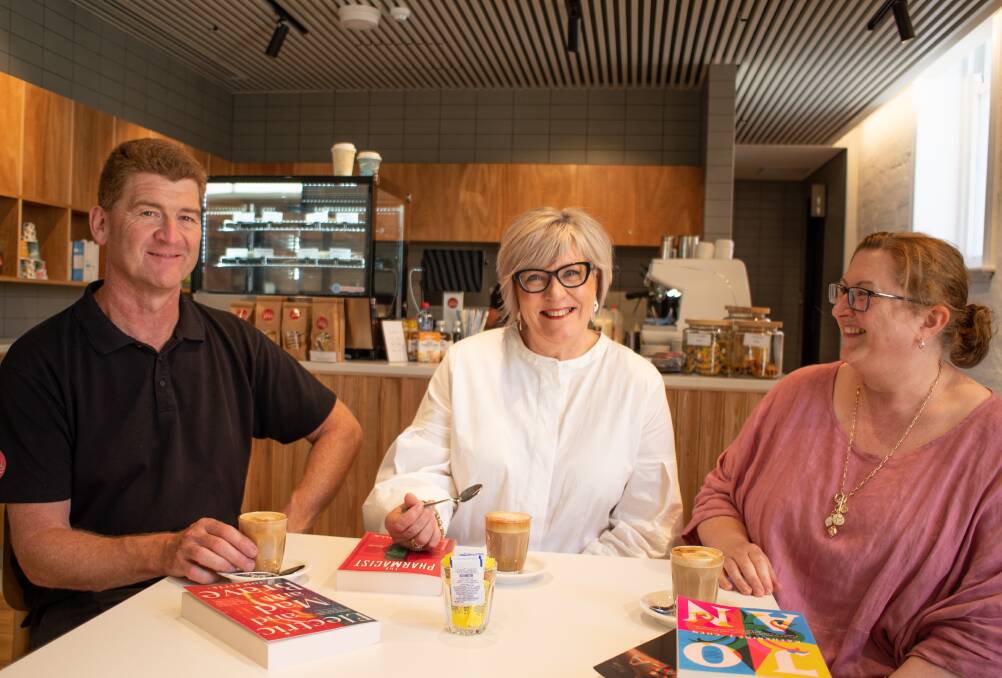 Warrnambool mayor Debbie Arnott celebrates the opening of the library cafe with Tasty Plate catering manager Steve Weber and executive manager Maree Wyse. Picture supplied