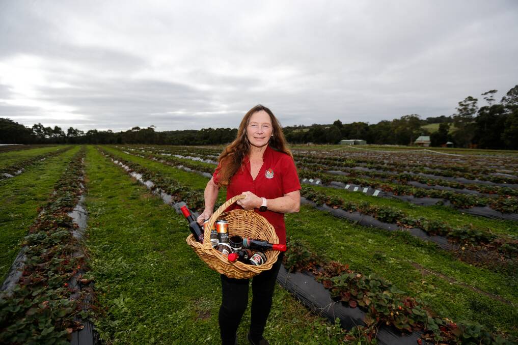 Back in business: Heather Nicholls has a new range of strawberry wine, liquor and cider after rebuilding the cafe that burnt down in 2020. Picture: Anthony Brady 