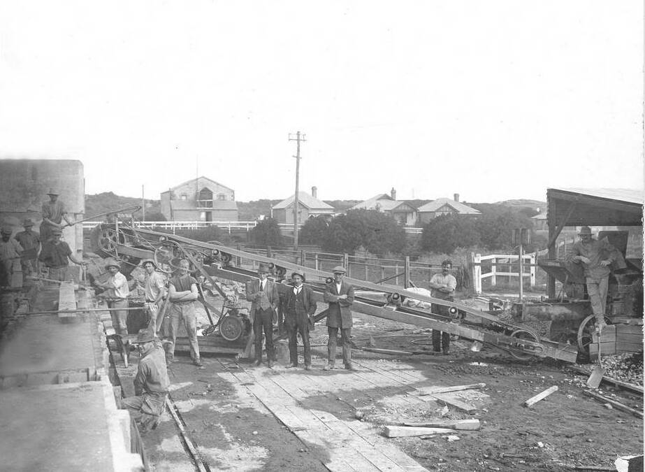 Time capsule: This photo from 1890 shows the concrete blocks used in the construction of the breakwater located in the railway reserve beside the Merri River. Edwards Bridge is in the background and the building behind is believed to be the one Roger Edwards lived in until 1947. SOURCE: Warrnambool & District Historical Society.