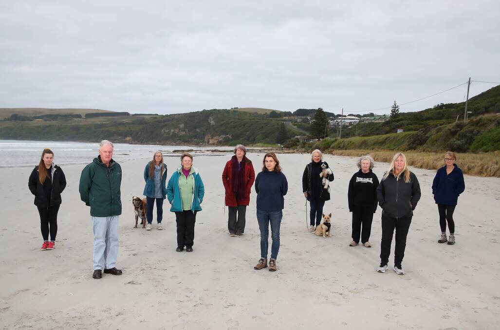 No: Save Cape Bridgewater association member Patrick O'Brien (second from left) with others who do not want to see a resort built in the town. Picture: Mark Witte
