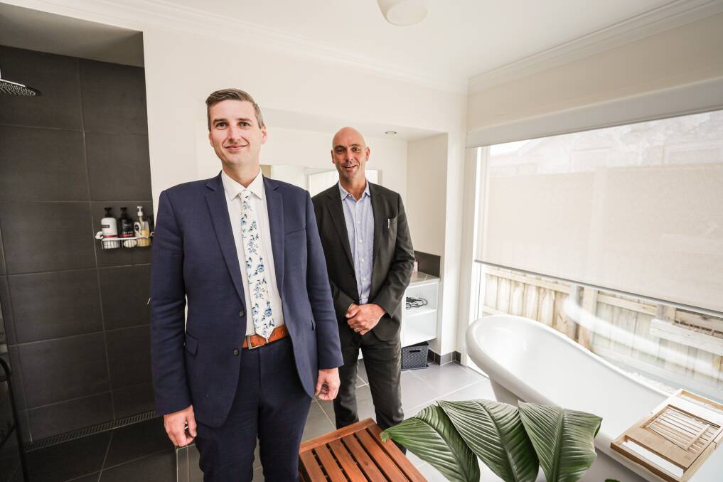 Wilsons Real Estate's Luke McQualter and Lucas Wilson at one of the holiday rental properties they manage. Picture by Sean McKenna