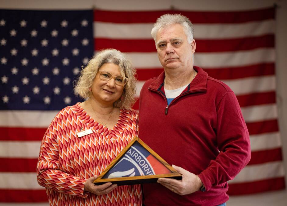 Lani and David Carroll with the American flag that has been sent to Warrnambool in honour of his dad Bill who was killed in the Vietnam War. They also have a flag from the 173rd Airborne that was also given to the family. Picture by Sean McKenna