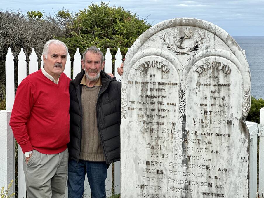 Alan McLean with Rec Mathieson at the newly uncovered memorial to the victims of the Fiji shipwreck.