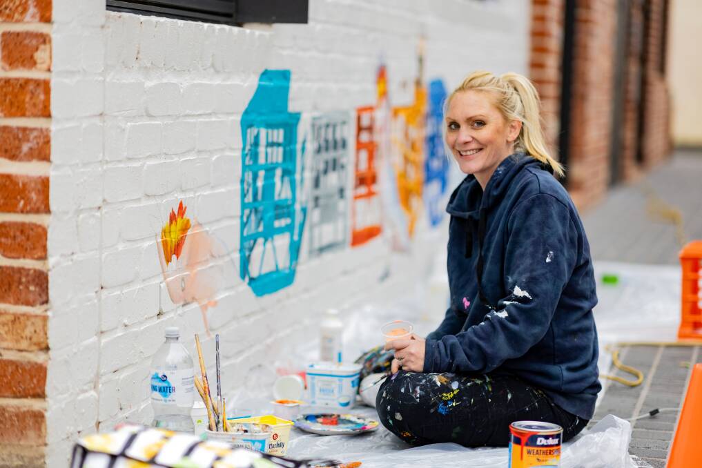 Melbourne artist Madeleine Simson is transforming Dispensery Lane off the Ozone car park. Picture by Anthony Brady