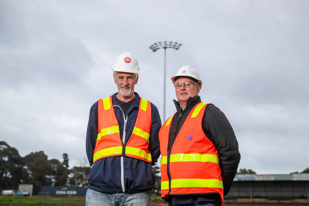 Milestone: New lights have been installed at Reid Oval and Warrnambool and District Cricket Association's Terry O'Keefe and Warrnambool Football Club Ray Phillips can't wait to play on the new facility. Picture: Morgan Hancock
