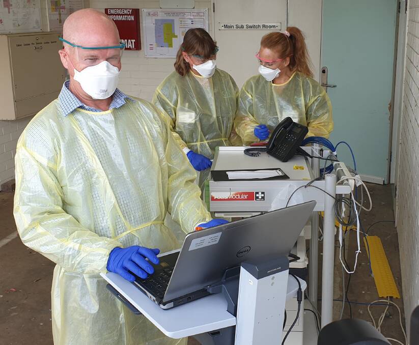 Nurses at the Hamilton drive-thru testing clinic set up to test for coronavirus.