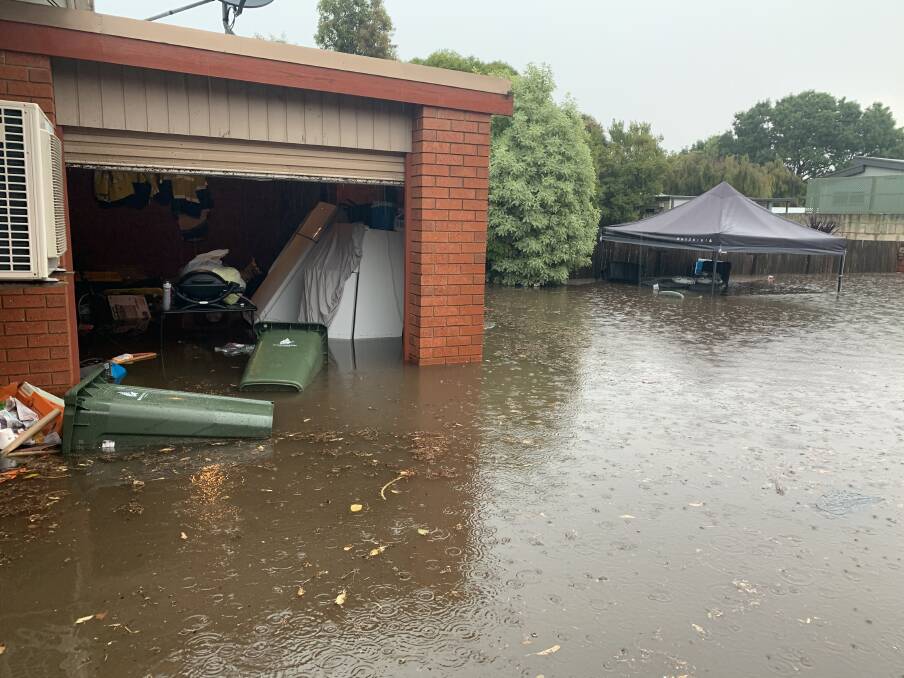 Inundated: The water was almost a metre high across Paul Harris' backyard.