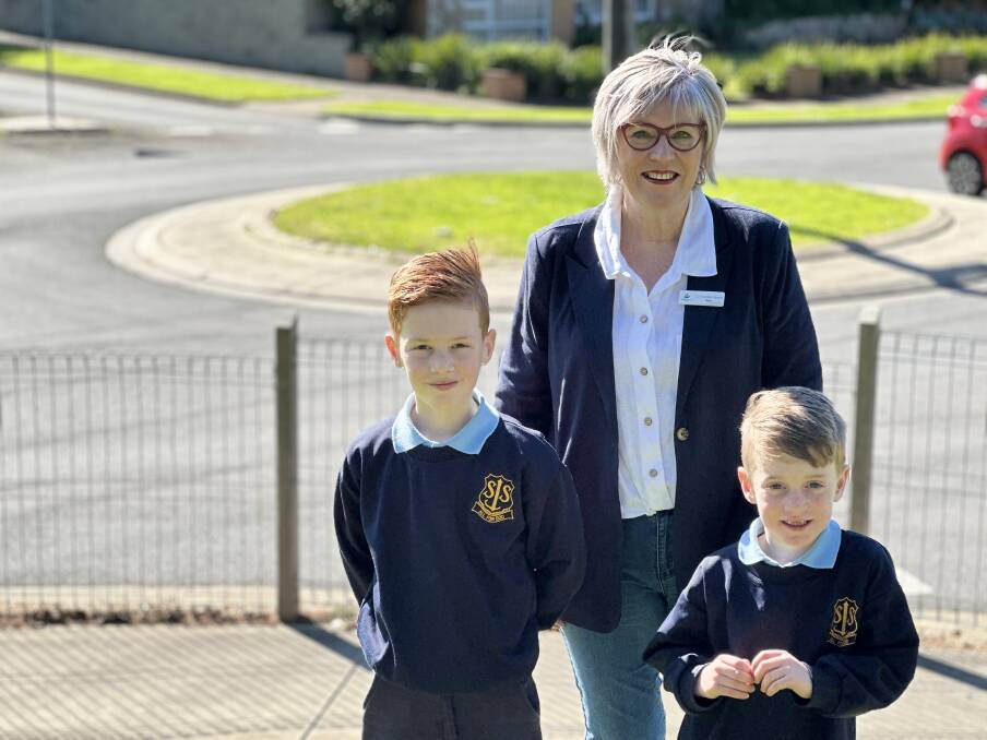 Warrnambool mayor Debbie Arnott with St Joseph's Primary School pupils Elliot, 8, and Austin Smock, 6, at the roundabout that will undergo a major upgrade.