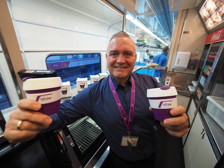 Tea time: V/Line food service manager Allan Lever with the new 'keep cups' which will now be allowed onboard for the first time from this week.