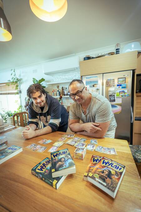 Jordan Gould and Richard Pritchard with their new book Wylah The Koorie Warrior Custodians and the game cards they are working on. Picture by Sean McKenna
