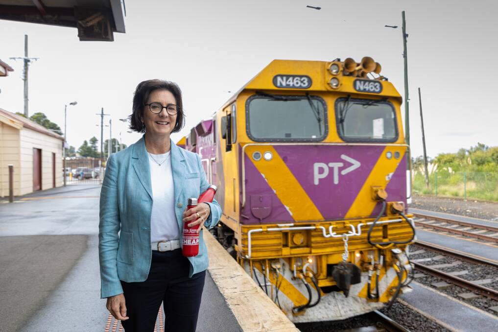 Labor MP Jacinta Ermacora was handing out free drink bottles to passengers taking advantage of the new cheaper train fares. Picture Eddie Guerrero