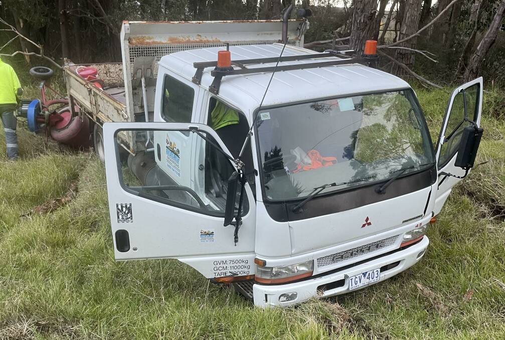 A truck become stuck after slipping off the Cobden Warrnambool Road.