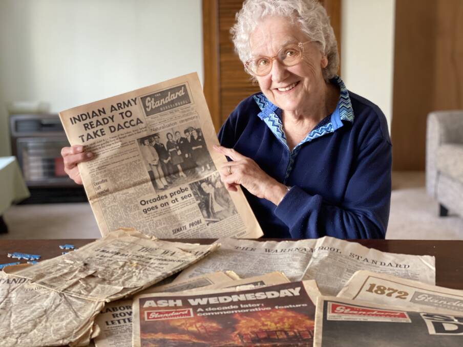 Marianne Tinker with a copy of The Standard when she made front page news on becoming a citizen in the 1970s. Picture by Katrina Lovell