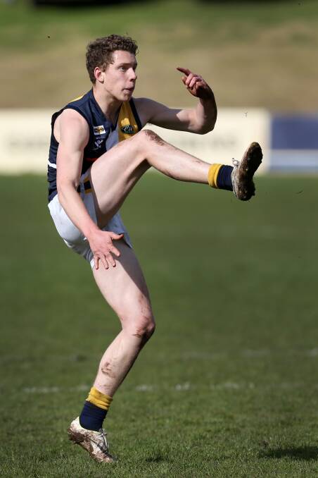 EARLY DAYS: Josh Corbett has a set shot while playing for North Warrnambool Eagles.